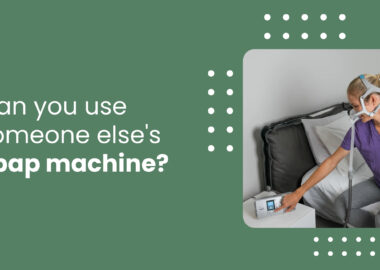 Image with text asking if it's safe to use someone else's CPAP machine, alongside a photo of a woman wearing a CPAP mask while adjusting the machine beside her bed